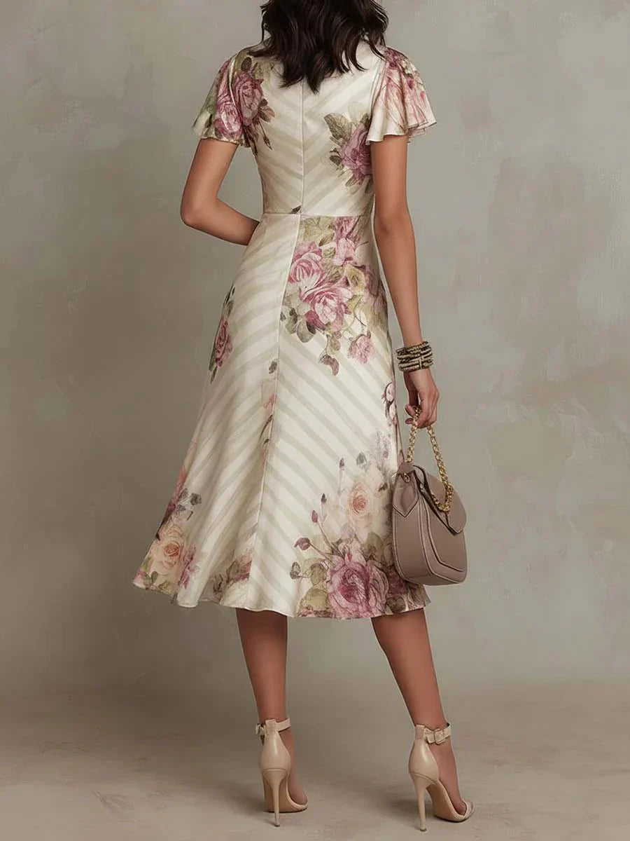 Alba | Elegante vestido midi cruzado con fruncidos y estampado floral